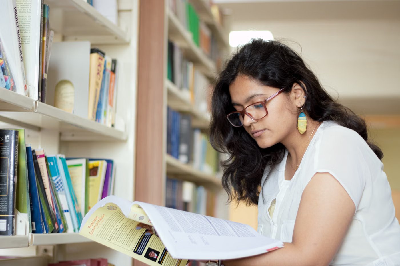 A cadet reading in the school library